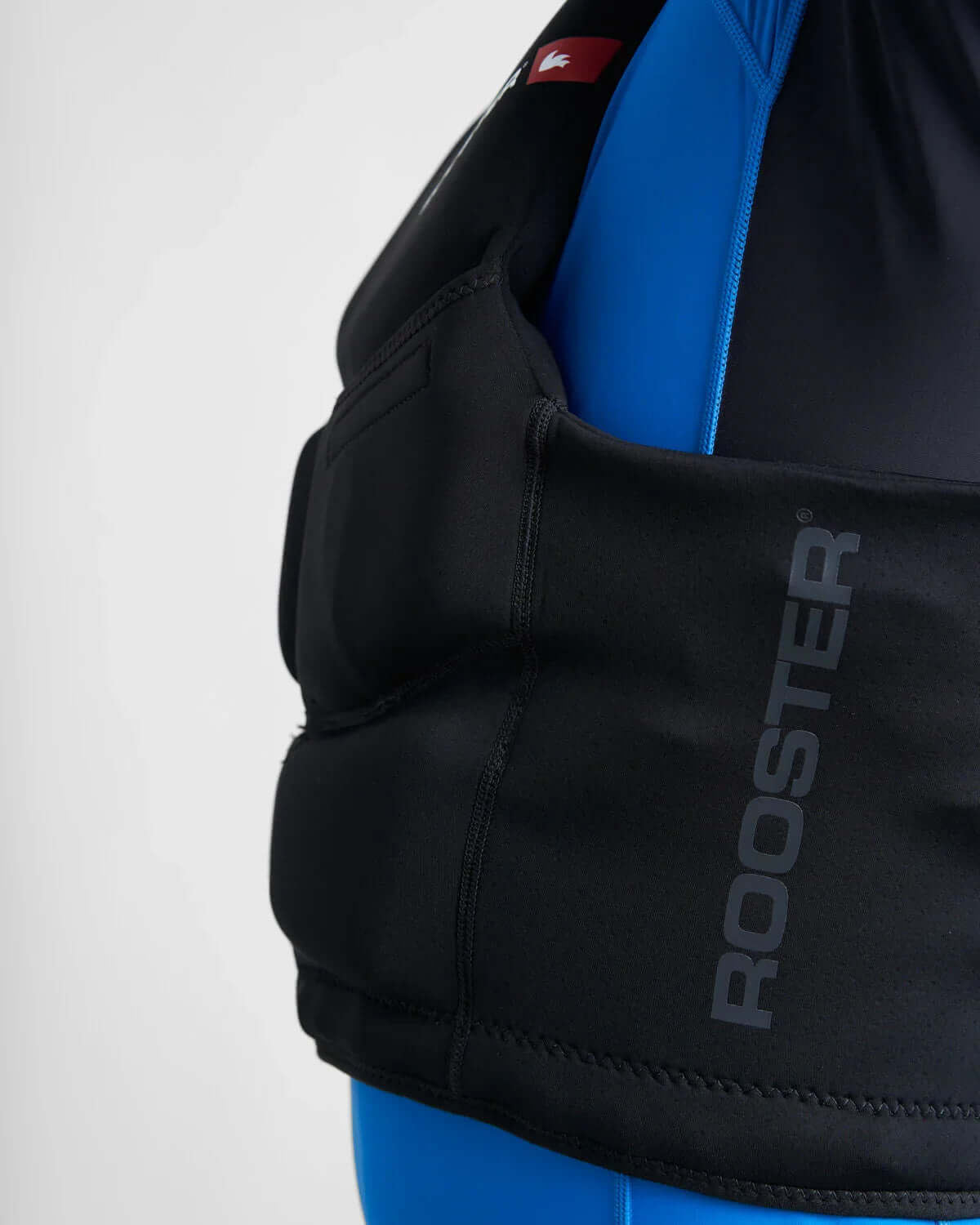 Gilet de sauvetage compact régate Rooster en néoprène pour une liberté de mouvement optimale sur l'eau.