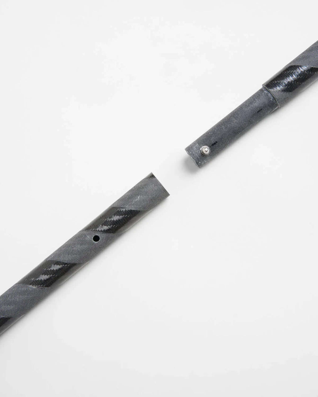 ILCA Travel carbon Tiller Extension 1250 close-up showing carbon fiber construction and connection detail.
