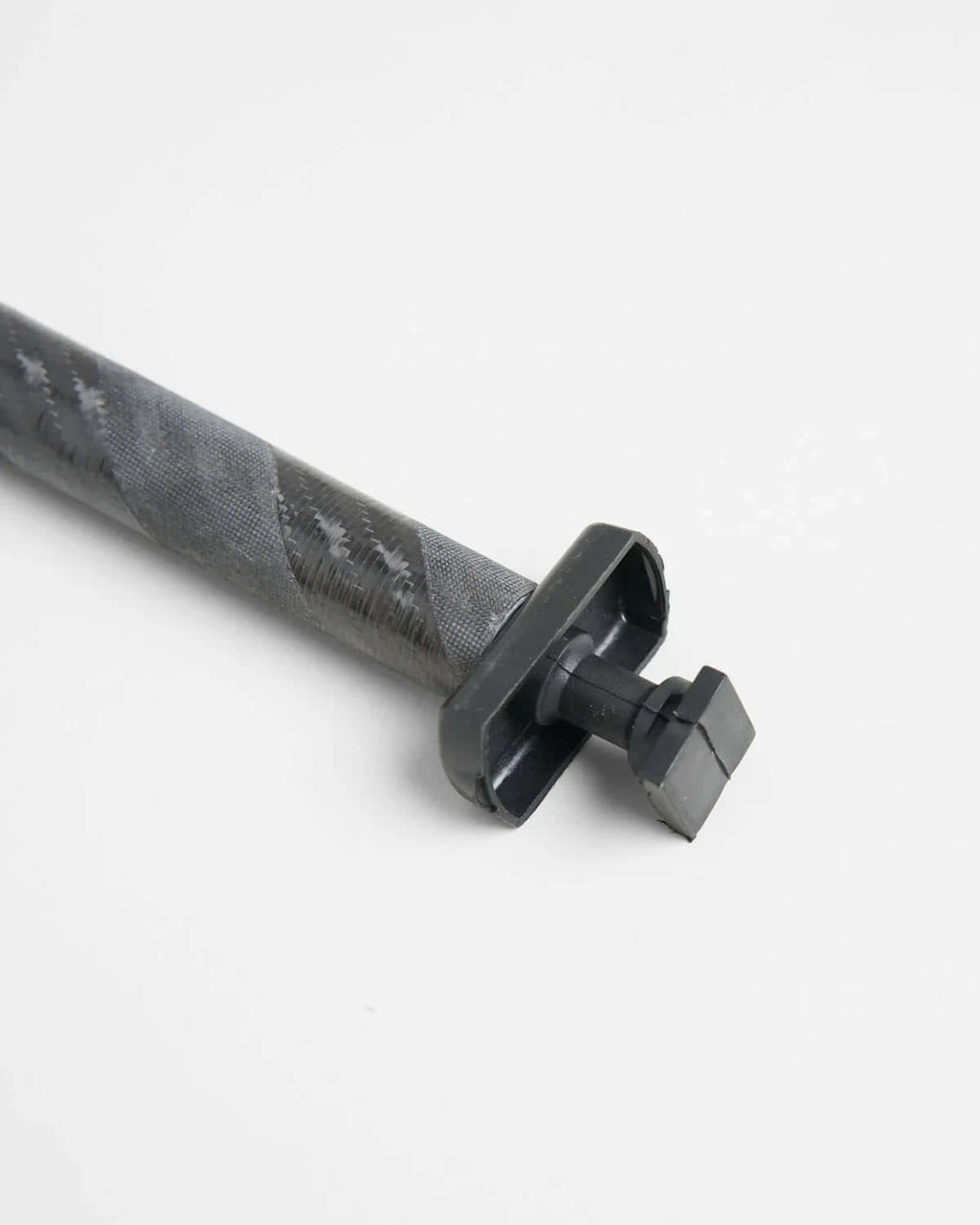 ILCA Travel carbon Tiller Extension 1250 close-up view, showcasing the carbon material and attachment design.