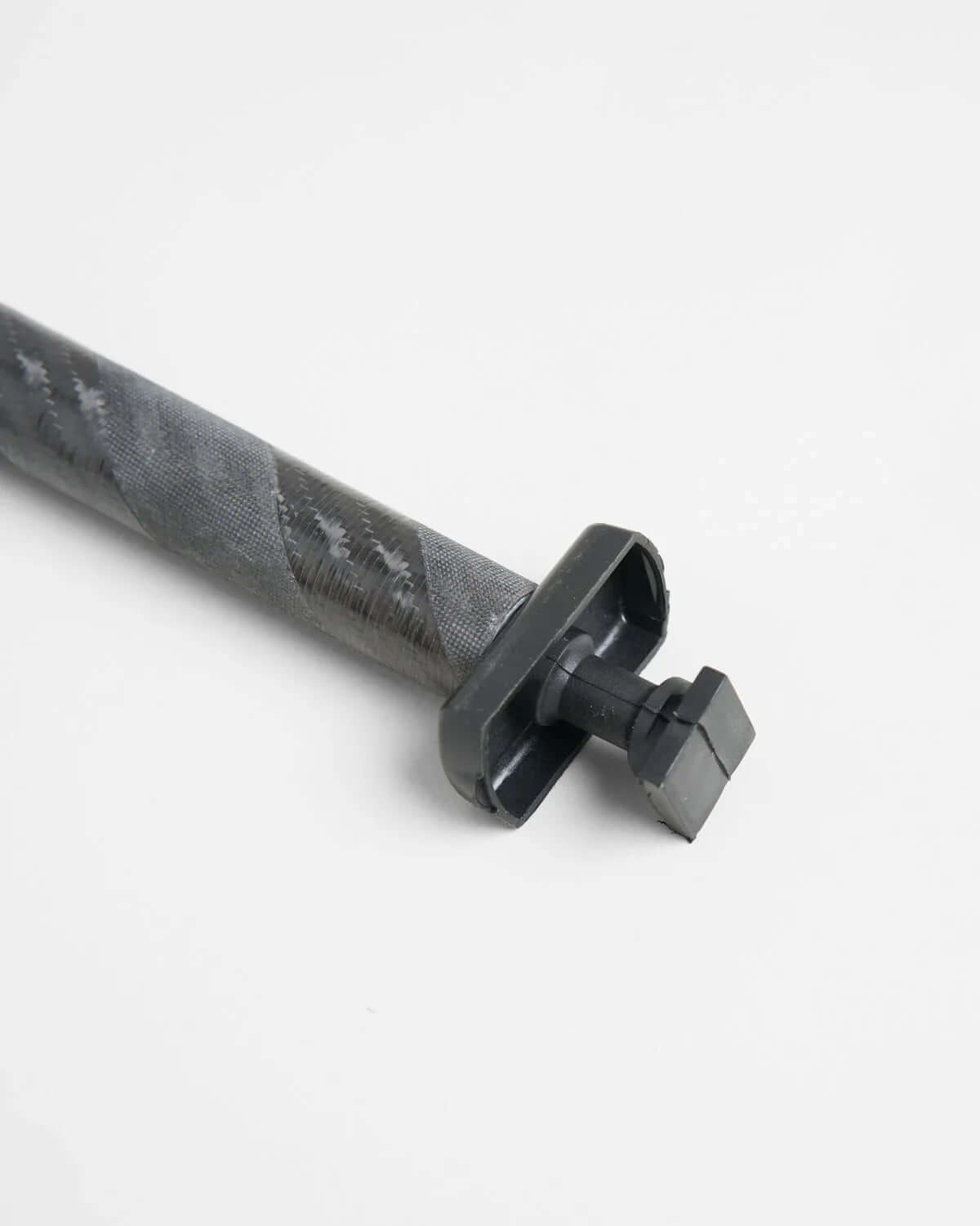ILCA Travel carbon Tiller Extension 1250 close-up view, showcasing the carbon material and attachment design.