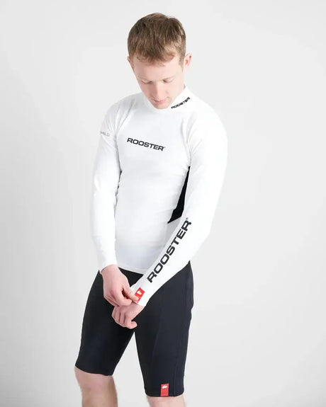 Rash Top-Long Sleeved en lycra spandex avec logo Rooster, conçu pour protection anti-UV lors d'activités nautiques.