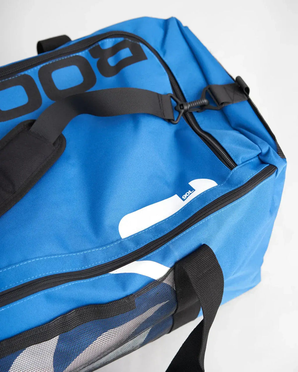 Sac multifonctions 90L en couleur bleue, vue de dessus, avec bandoulière et détails techniques.