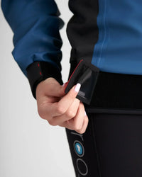 Top Pro Aquafleece Women showing flexible Aquafleece fabric and waterproof pocket detail.